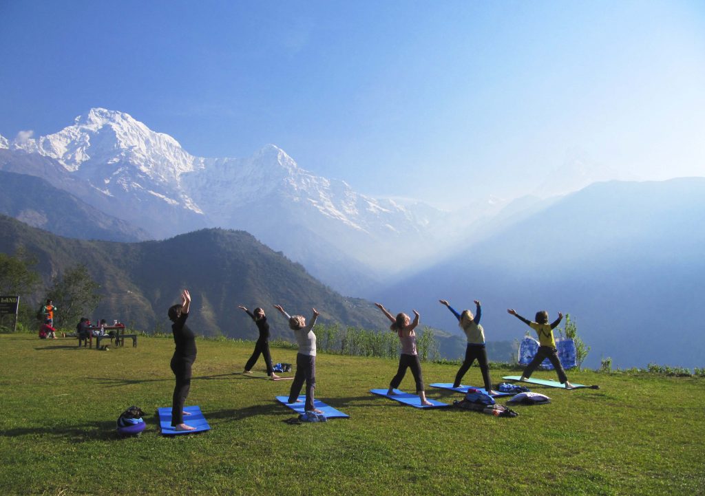 Receiving the positive energy from the sun with Yoga